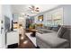 Inviting living room with hardwood floors and large sectional sofa at 1405 Ne 55Th St, Ocala, FL 34479