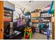 Well-organized storage room featuring shelving units, storage boxes, and miscellaneous household items at 1405 Ne 55Th St, Ocala, FL 34479