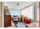 Enclosed sun room with storage, chair, and natural light at 1405 Ne 55Th St, Ocala, FL 34479