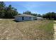 The backyard of the house with a gray exterior at 14437 Sw 21St Pl, Ocala, FL 34481