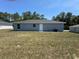 The backyard of the house with a gray exterior at 14437 Sw 21St Pl, Ocala, FL 34481