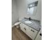 Bathroom featuring white cabinets, granite countertops and modern fixtures at 14437 Sw 21St Pl, Ocala, FL 34481