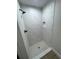 Bathroom with tile shower, white cabinets, and granite countertops at 14437 Sw 21St Pl, Ocala, FL 34481