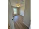 A well lit bedroom includes a window and ceiling fan for comfort and natural light at 14437 Sw 21St Pl, Ocala, FL 34481