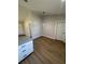 Open dining space showcasing wood-look floors and neutral wall paint at 14437 Sw 21St Pl, Ocala, FL 34481