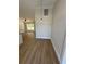 Open dining area featuring wood-look floors and natural light from the adjacent living room at 14437 Sw 21St Pl, Ocala, FL 34481