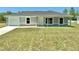 Charming single-story home featuring a well-maintained lawn and an attached one car garage at 14437 Sw 21St Pl, Ocala, FL 34481