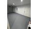 Spacious garage with a gray painted floor and automatic door opener at 14437 Sw 21St Pl, Ocala, FL 34481