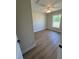 This bedroom features neutral paint, wood look floors, white trim and ceiling fan at 14443 Sw 21St Pl, Ocala, FL 34481