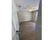 A light-filled bedroom with wood flooring, a ceiling fan, and white trim at 14443 Sw 21St Pl, Ocala, FL 34481
