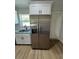 Stainless steel side-by-side refrigerator and freezer with water and ice dispenser at 14443 Sw 21St Pl, Ocala, FL 34481