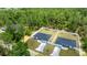 Aerial view of two new homes, featuring fenced yards and long driveways at 15350 Sw 30Th Street, Ocala, FL 34481