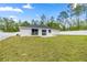 The backyard has a freshly sodded lawn, white privacy fence, and a small patio at 15350 Sw 30Th Street, Ocala, FL 34481