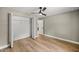 Bedroom with a bi-fold closet, ceiling fan and durable wood-look floors at 15350 Sw 30Th Street, Ocala, FL 34481