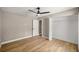 Bedroom featuring a spacious closet with white shelving and wood-look flooring at 15350 Sw 30Th Street, Ocala, FL 34481