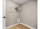 Functional laundry area with washer and dryer hookups, plus convenient overhead shelving at 15350 Sw 30Th Street, Ocala, FL 34481
