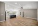 Spacious living area featuring wood floors and a modern kitchen with a center island at 15350 Sw 30Th Street, Ocala, FL 34481