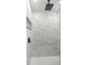 Stylish shower with sleek marble tiling and a modern rain shower head for a spa-like experience at 15350 Sw 30Th Street, Ocala, FL 34481