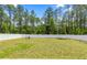 Large, newly-mowed backyard enclosed by a white vinyl fence at 15368 Sw 30Th St, Ocala, FL 34481