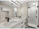 Modern bathroom boasts dual sinks, quartz counters, and a luxurious glass enclosed shower at 15368 Sw 30Th St, Ocala, FL 34481