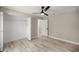 Bedroom with wood-look floors, a closet, and neutral paint at 15368 Sw 30Th St, Ocala, FL 34481