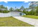 Well-maintained, light-blue home featuring a spacious driveway and partial fencing at 15368 Sw 30Th St, Ocala, FL 34481