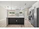 Modern kitchen featuring an island with an elegant countertop and stainless steel appliances at 15368 Sw 30Th St, Ocala, FL 34481