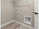 Bright laundry room with wood-look floors and washer/dryer hookups at 15368 Sw 30Th St, Ocala, FL 34481