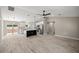 A bright, open-concept living space with sleek flooring and a modern kitchen at 15368 Sw 30Th St, Ocala, FL 34481