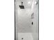 Close up of modern walk in shower with marble tile and rain shower head at 15368 Sw 30Th St, Ocala, FL 34481