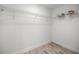Walk-in closet with wood-look floors and wire shelving at 15368 Sw 30Th St, Ocala, FL 34481