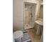Compact bathroom with a stand-up shower and pedestal sink at 18 Fir Trail Dr, Ocala, FL 34472