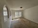 A bright bedroom featuring unique arched wall cutouts and a large window at 18 Fir Trail Dr, Ocala, FL 34472