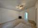 Bright bedroom with a ceiling fan providing comfortable climate control, complemented by clean, neutral walls and carpets at 18 Fir Trail Dr, Ocala, FL 34472