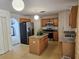 Kitchen with granite countertops, stainless steel appliances, and an island at 18 Fir Trail Dr, Ocala, FL 34472