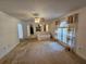 Bright living room showcasing elegant arches, an open layout, and natural light, perfect for relaxation at 18 Fir Trail Dr, Ocala, FL 34472