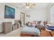 Bedroom with neutral carpet, ceiling fan, and a view to the bathroom at 2008 Tweed Ct, Leesburg, FL 34788
