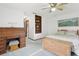 Bedroom with an antique desk, ceiling fan, and built-in shelves at 2008 Tweed Ct, Leesburg, FL 34788