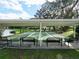 A peaceful bocce ball court with seating, perfect for leisurely games and social gatherings by the water at 2008 Tweed Ct, Leesburg, FL 34788