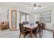 Bright dining area featuring a wooden table, comfortable seating, and plenty of natural light at 2008 Tweed Ct, Leesburg, FL 34788