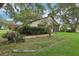 Well-maintained single Gathering home with mature landscaping and a beautiful lawn at 2008 Tweed Ct, Leesburg, FL 34788