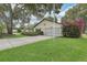 Inviting single-story home featuring a well-manicured lawn and lush bougainvillea at 2008 Tweed Ct, Leesburg, FL 34788