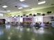 Large meeting room with tables and chairs, decorated with plants; ideal for events, gatherings, and community activities at 2008 Tweed Ct, Leesburg, FL 34788