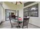 Enclosed patio with a glass table and seating, perfect for outdoor dining at 2008 Tweed Ct, Leesburg, FL 34788
