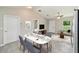 Comfortable dining area adjacent to the living room and kitchen, perfect for Gathering meals at 20443 Sw Rainbow Lakes Blvd, Dunnellon, FL 34431