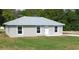 Charming single-story home with a well-maintained lawn, new roof, and modern windows at 20443 Sw Rainbow Lakes Blvd, Dunnellon, FL 34431