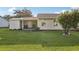 Exterior view of backyard featuring a covered patio at 2208 Orkney Dr, Leesburg, FL 34788