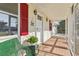 Cozy front porch featuring brick flooring and an inviting entrance at 2208 Orkney Dr, Leesburg, FL 34788