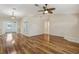 Inviting living room featuring hardwood floors, a ceiling fan, and open layout at 2208 Orkney Dr, Leesburg, FL 34788
