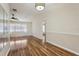 The living room features natural light, wood floors, and modern lighting at 2208 Orkney Dr, Leesburg, FL 34788